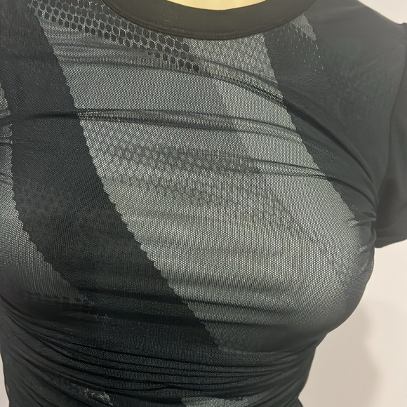 Never worn BCBG mesh overlay black dress asymmetrical designs underneath size XS - Picture 4 of 5